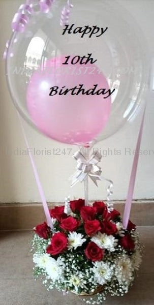 CHOOSE YOUR NUMBER ON Transparent Birthday Balloon with number with Pink balloon inside perched on top of 20 red and white roses C-BFST