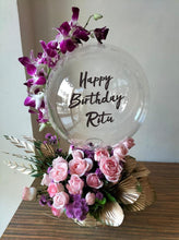 Load image into Gallery viewer, Print text with happy birthday on clear balloon with orchid trailing on the balloon perched on top of pink roses with Gold colour leaves C-BFST
