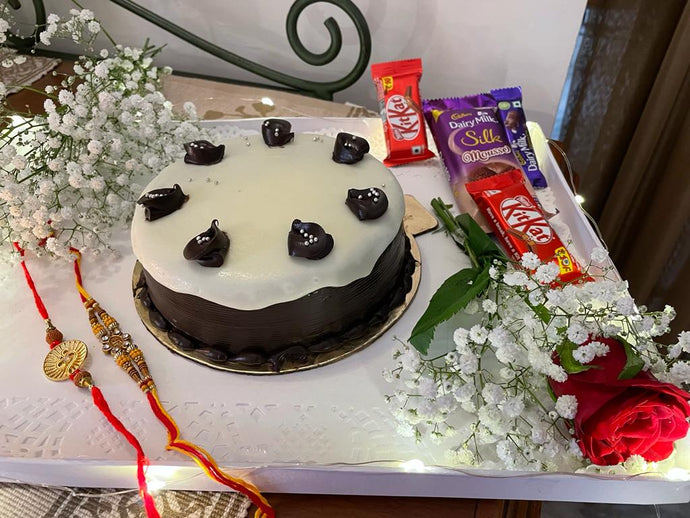 Rakhi, Flowers, Chocolates and Cake Combo - cake & assorted chocolates Indiaflorist247