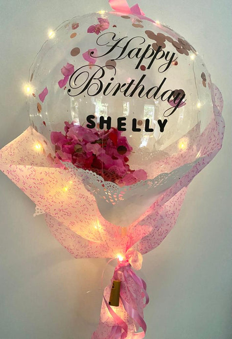Rose Petals inside a Clear balloon with printed text Happy Birthday OR Happy Anniversary OR Congratulations C-BFST