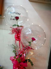 Load image into Gallery viewer, Rose inside a Clear balloon with printed text Happy Birthday OR Happy Anniversary OR Congratulations C-BFST
